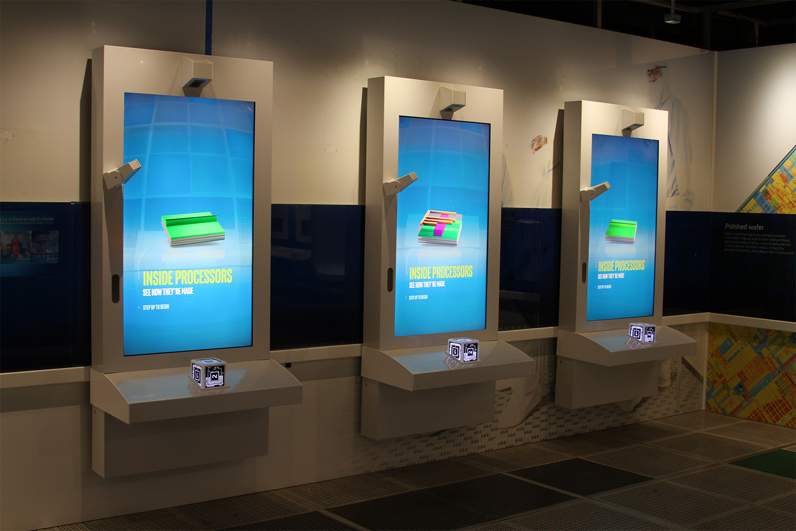 Intel Museum exhibit with 3 screens and lighted cubes