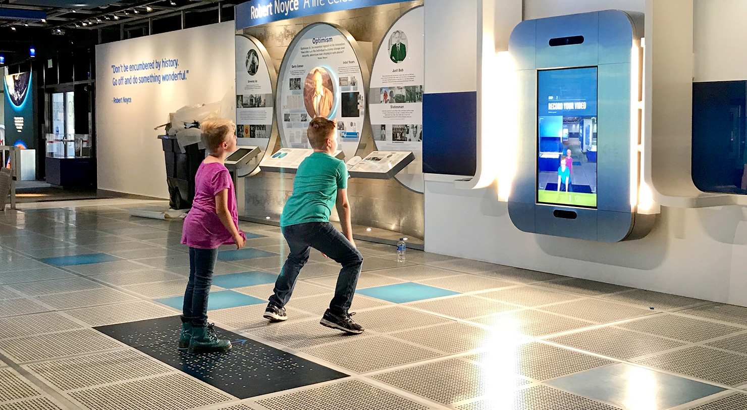 Two children at Intel Museum playing with AR exhibit