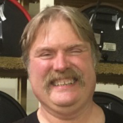 Dr. Bumpy face with great smile and a mustache