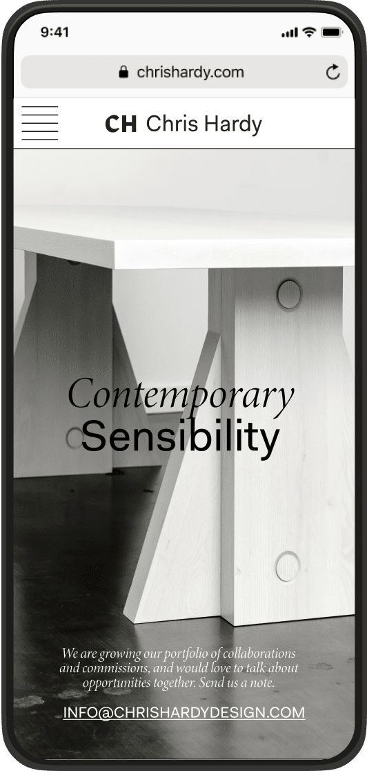 Smartphone screen showing Chris Hardy website with a modern wooden table and text 'Contemporary Sensibility' and contact email info@chrishardydesign.com.