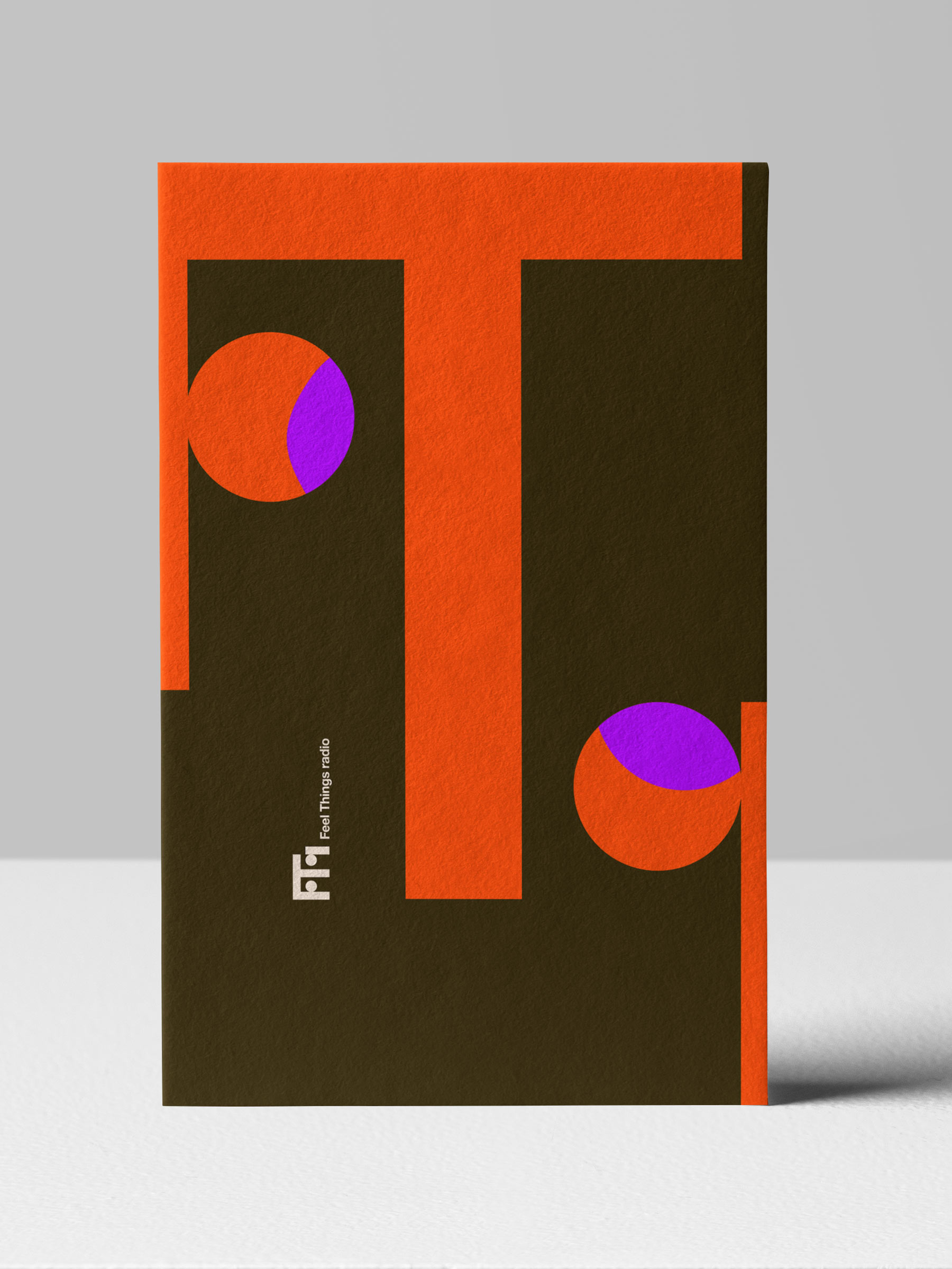 Abstract geometric design with large orange 'T' shape and purple-orange circles on dark brown background with 'Feel Things radio' text.