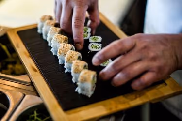 Sushi chef plating sushi