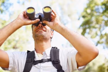 Man bird watching