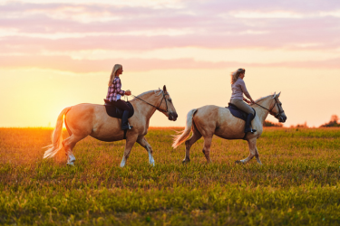 Two women horse riding