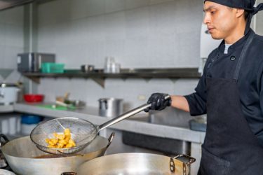 Man frying fish