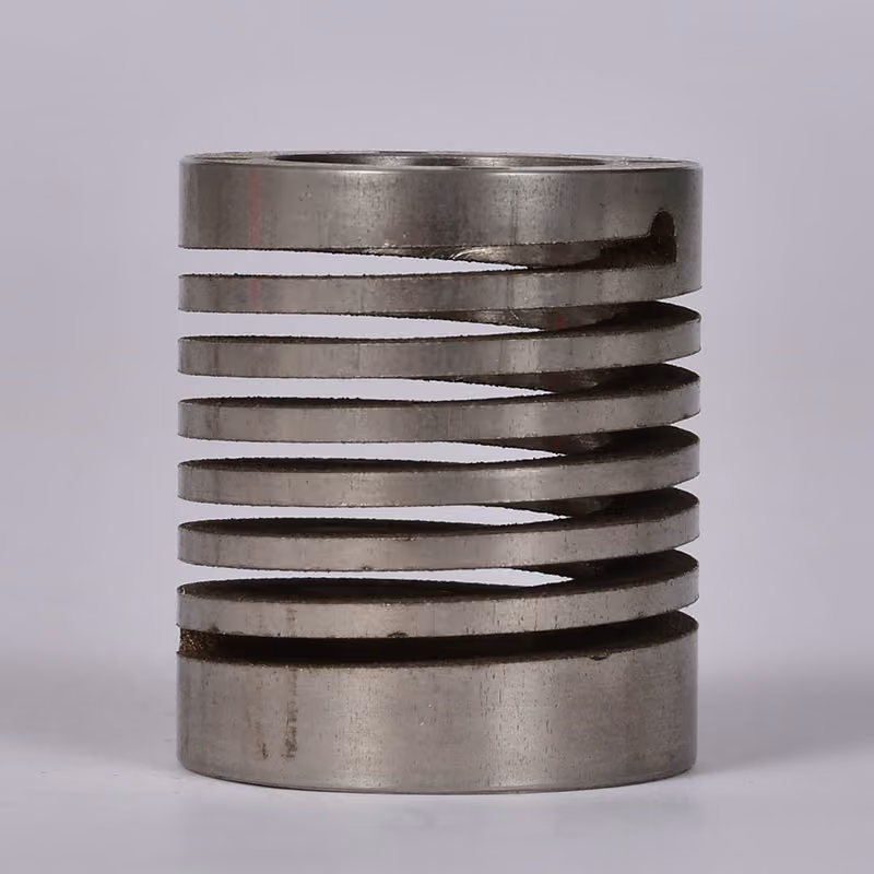 Machined flexible shaft coupling with spiral cuts