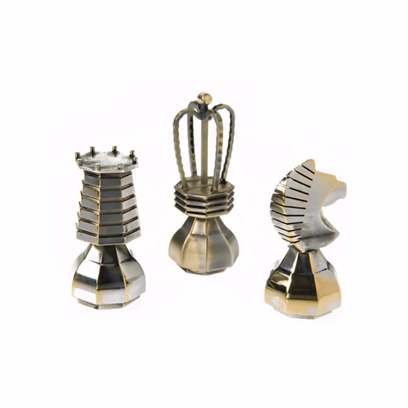 Set of small turned metal parts with slotted features