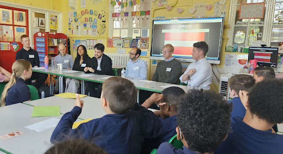 Kyndril volunteers and Skills Builder staff delivering an Essential Skills teaching day at a primary school