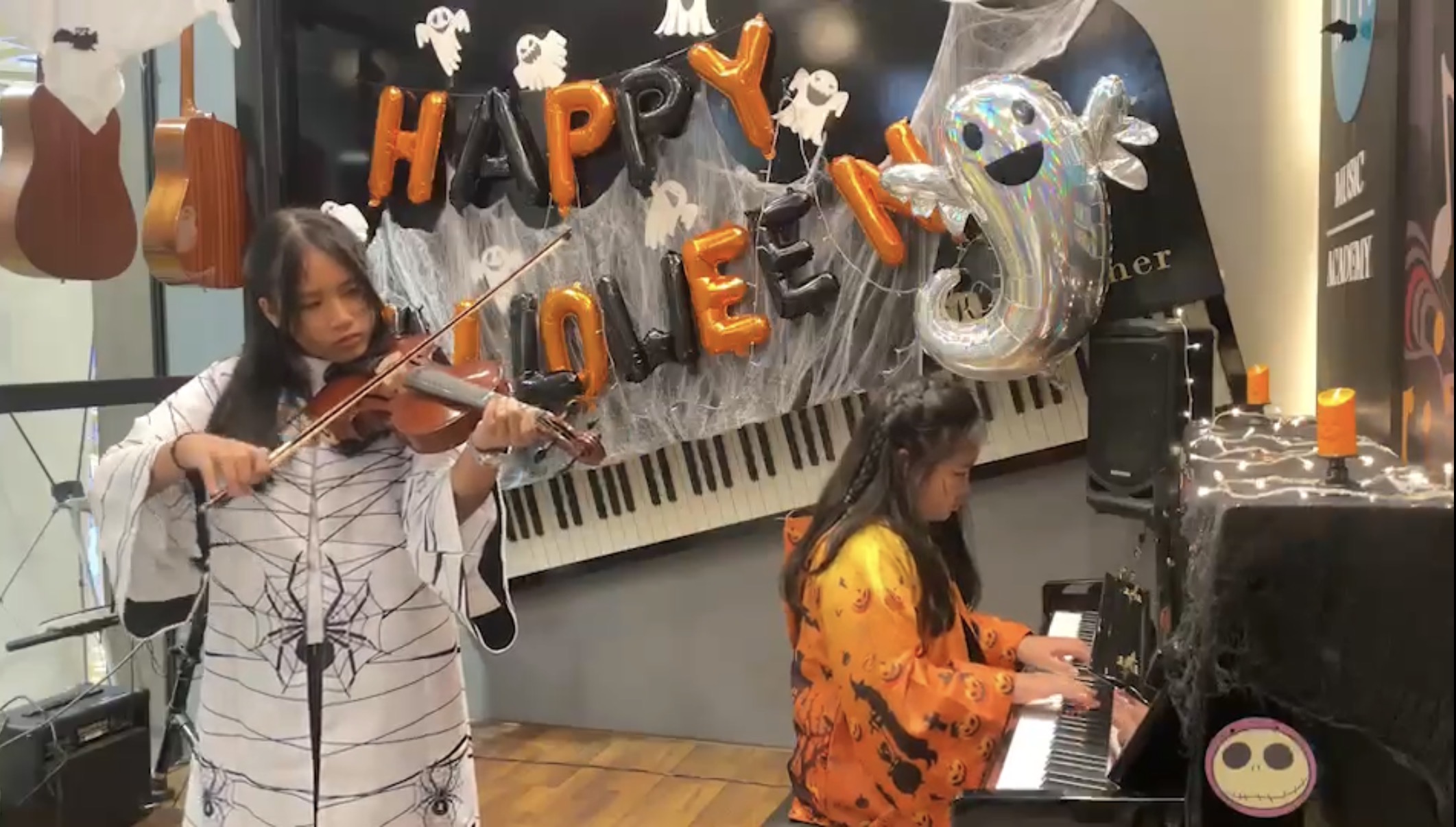 iPhone and Nano playing in a Halloween recital.