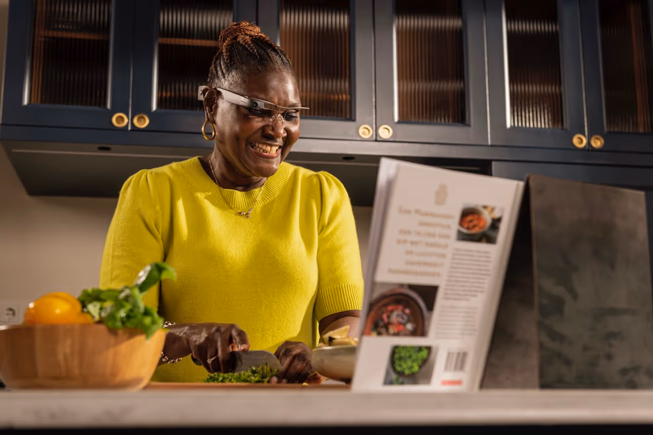 A person with the Envision Glasses reading a cookbook