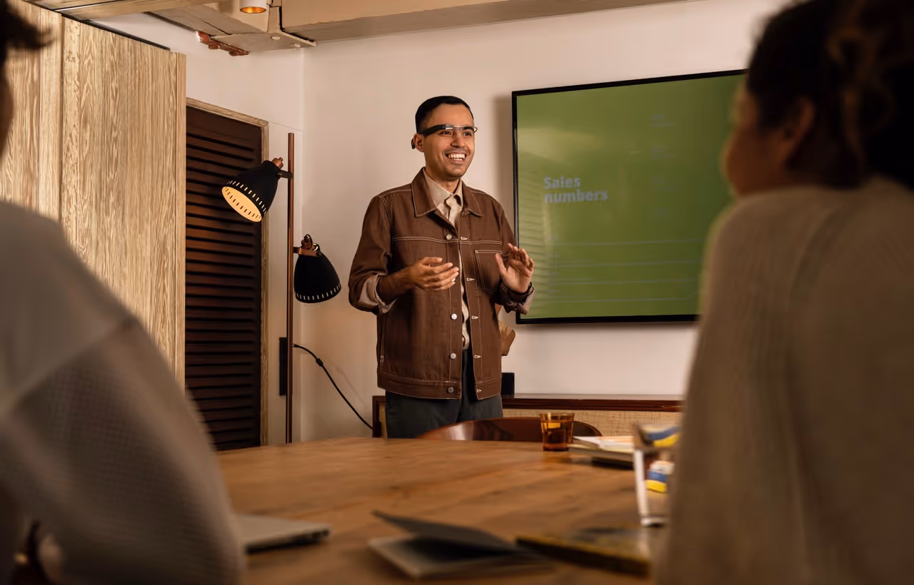 A man in the office giving a speech using envision glasses