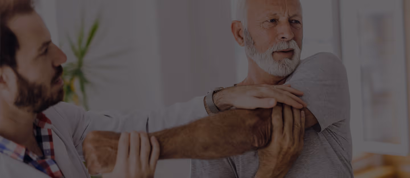 A chiropractor applying a controlled adjustment to a patient lying face-down.