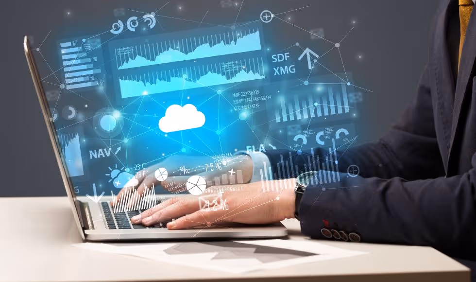 a businessman typing on a laptop with cloud reports and graph concepts around