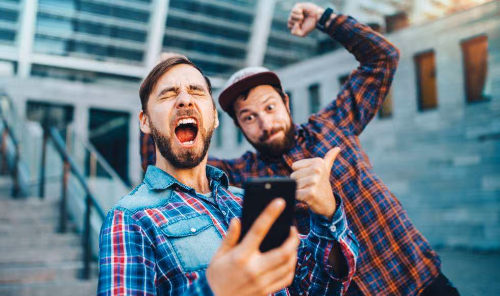 Two men celebrating