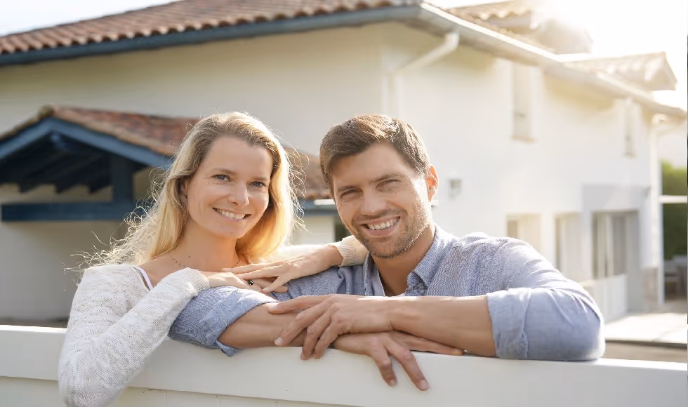 couple in front of investment property
