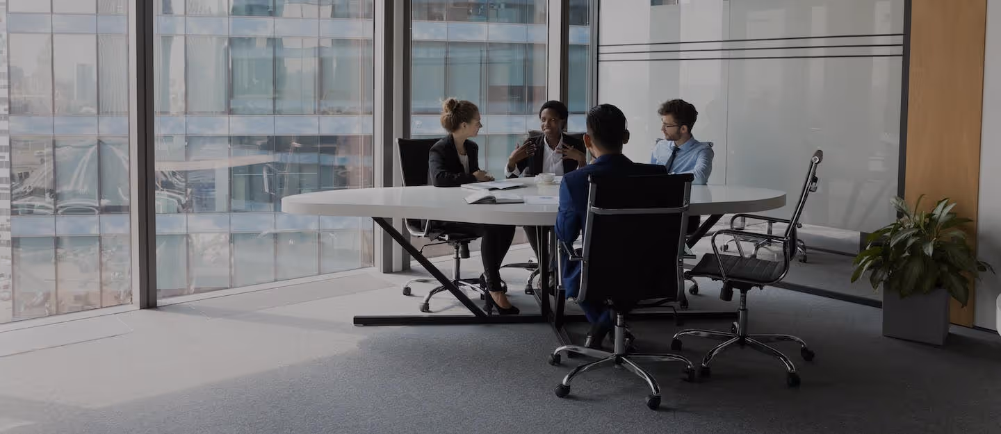 Modern office interior with a small team of business accountants having a meeting 