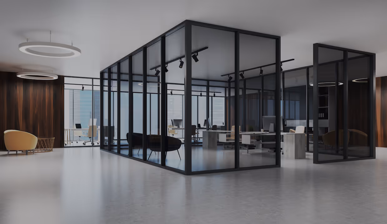 Modern office with a self-contained area of desks in the middle 