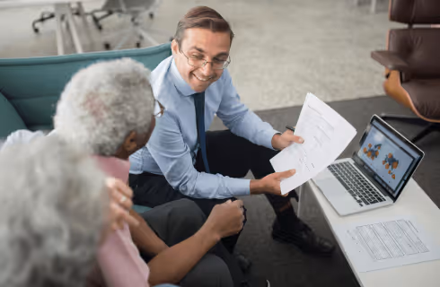 Accountant discussing taxes with older couple