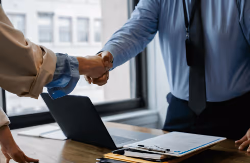 Accountant and business owner shaking hands 