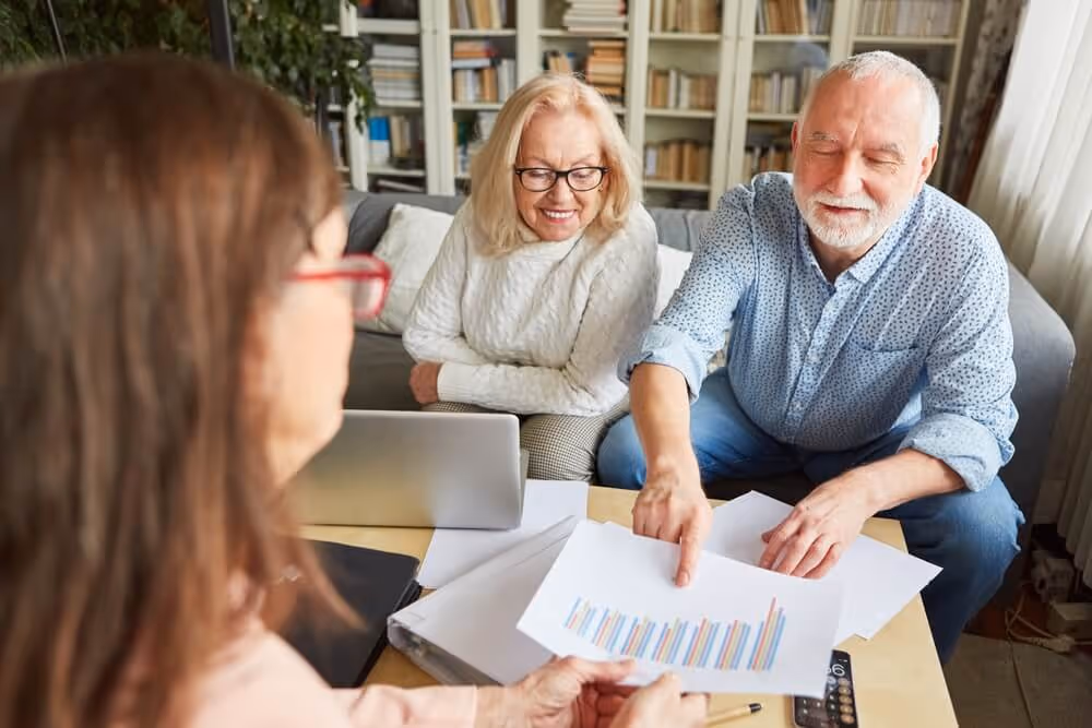 The same older couple as before smile with relief now that their accountant has explained how in species transfers can help them.