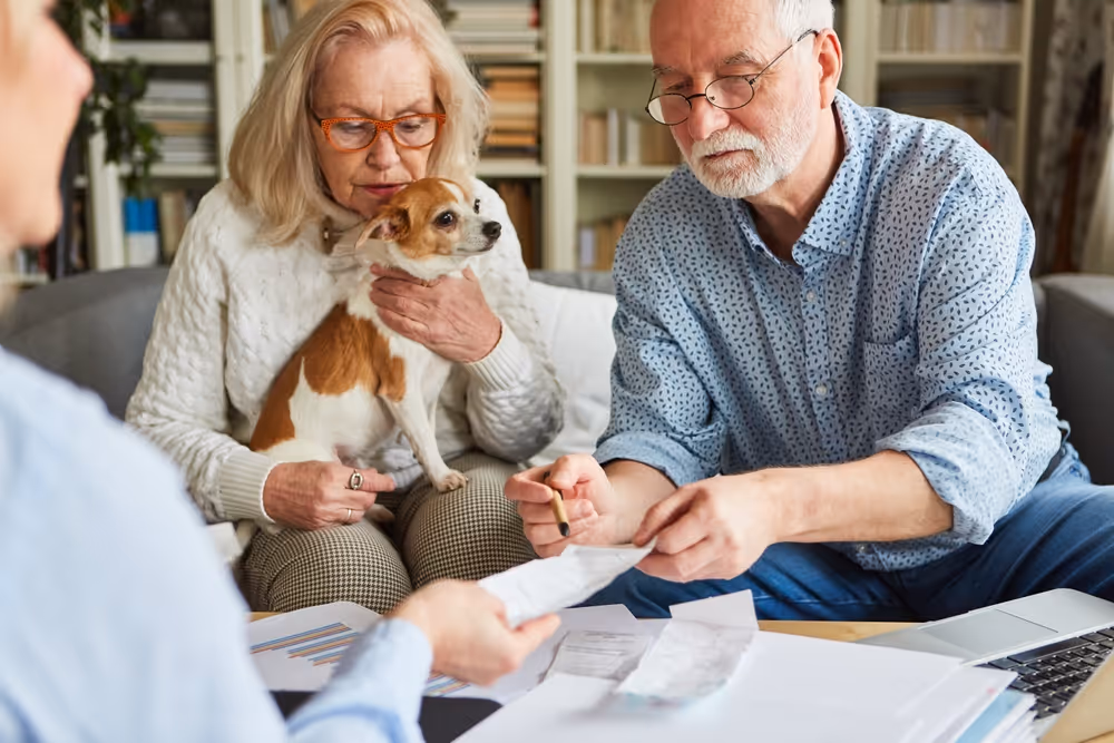 A retired couple sit down with their SMSF accountant to review their super and discuss in species transfers.