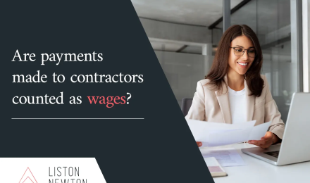 Businesswoman smiling while reviewing paperwork at a laptop beside the headline Are payments made to contractors counted as wages