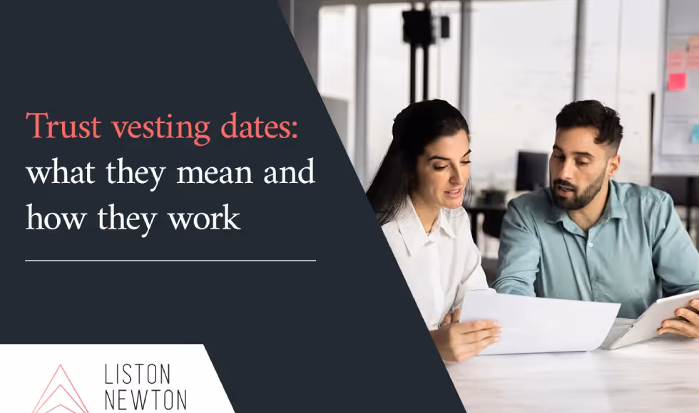 Two professionals reviewing a document with the headline Trust vesting dates what they mean and how they work.