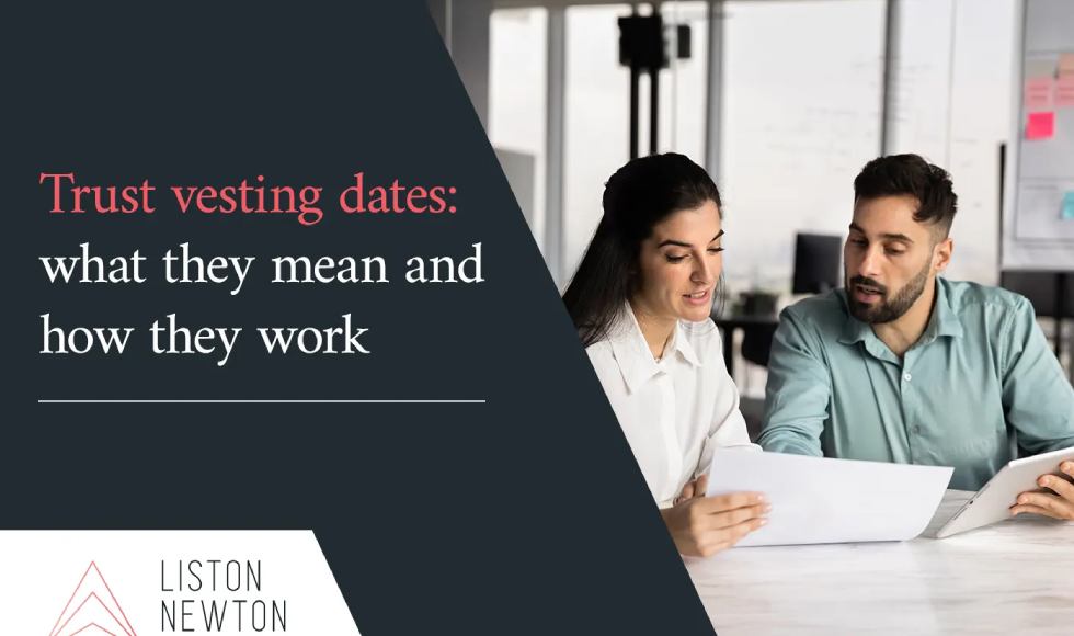 Two professionals reviewing a document with the headline Trust vesting dates what they mean and how they work.