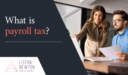 Business owner reviewing payroll and wage data with an adviser in an Australian office.