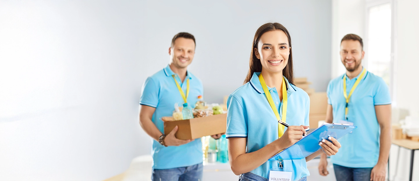 Volunteer organisation staff using administrative and accounting processes to support charitable operations and community programs.