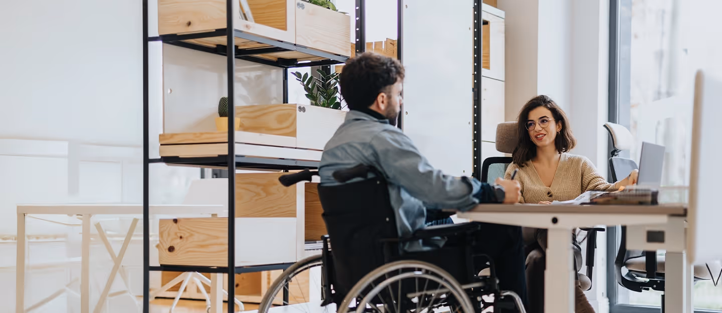 Disability support provider meeting with an NDIS participant to manage care services, funding, and administrative support.