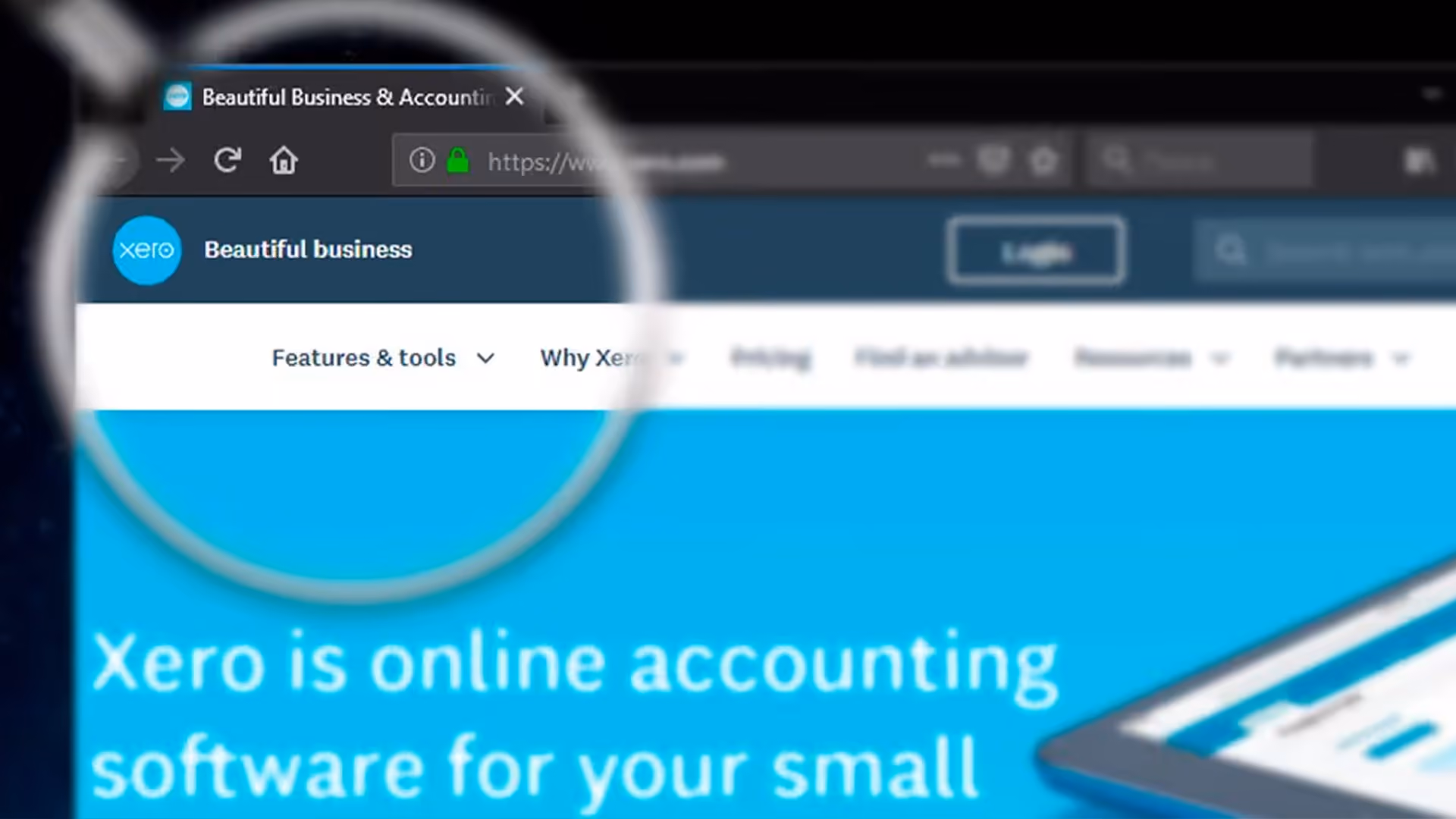Magnifying glass focused on the Xero accounting software website header showing the logo and "Beautiful business" slogan.