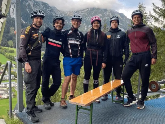 team on the peak of a mountain