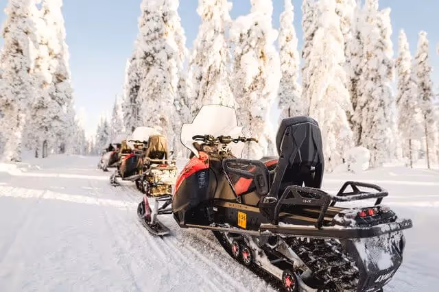 Full day snowmobile safari with lunch and ice fishing experience