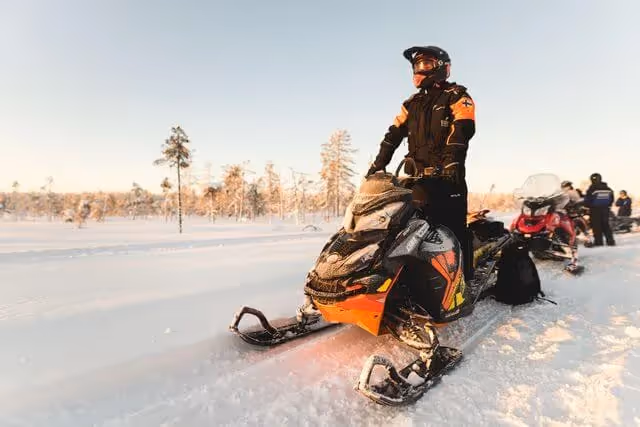 Full day snowmobile safari with lunch and ice fishing experience