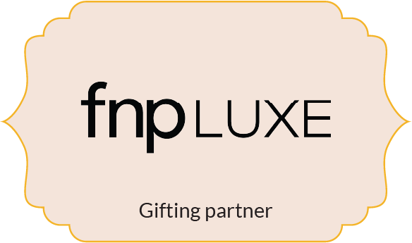 fnpLUXE branding with the tagline 'Gifting partner' on a beige decorative label background.