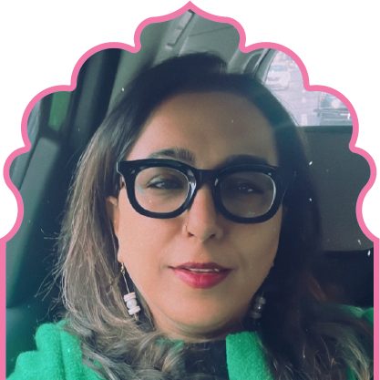 Smiling man wearing a blue pinstripe suit and light blue shirt against a yellow background with a pink outline.