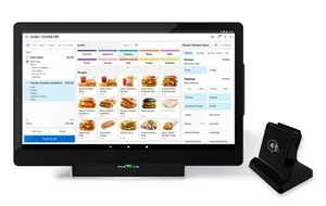 Point of sale system displaying a restaurant menu with food images and order options, next to a card reader device.