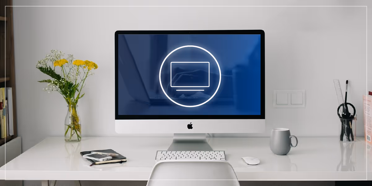 Computer on a desk with other office accessories.