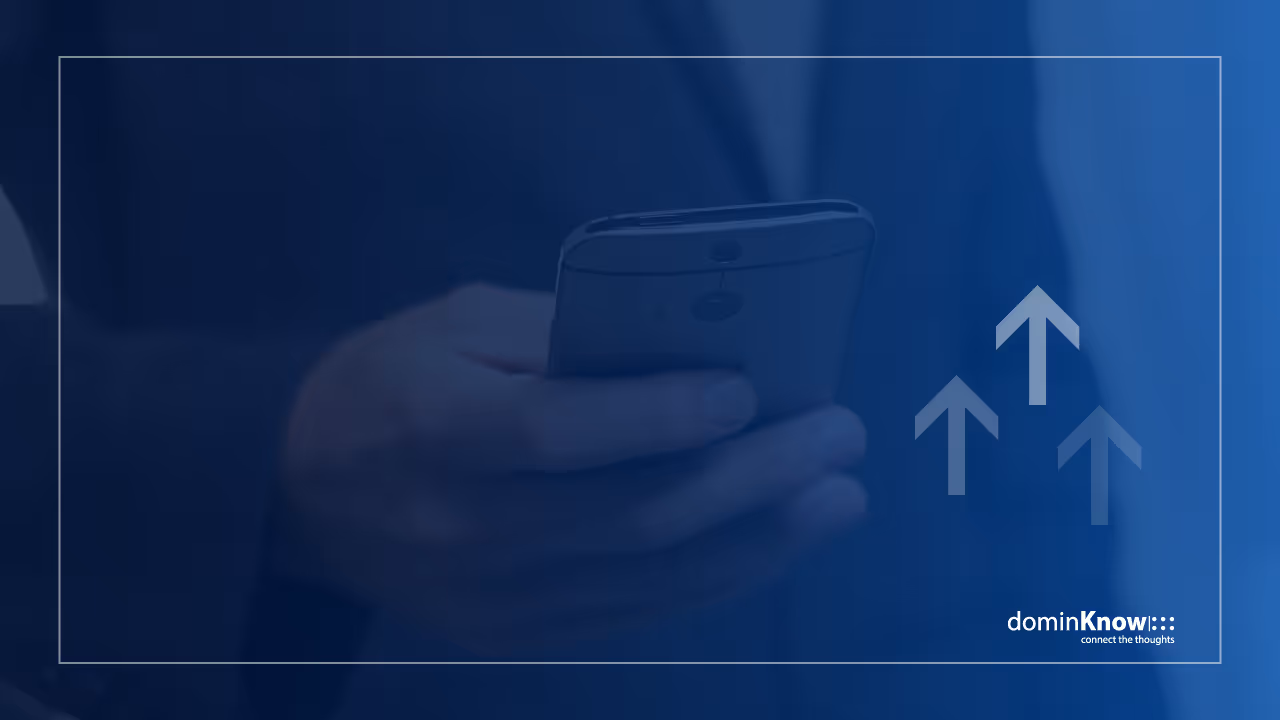 Blue background of man in suit holding a mobile device with arrows pointing upwards.