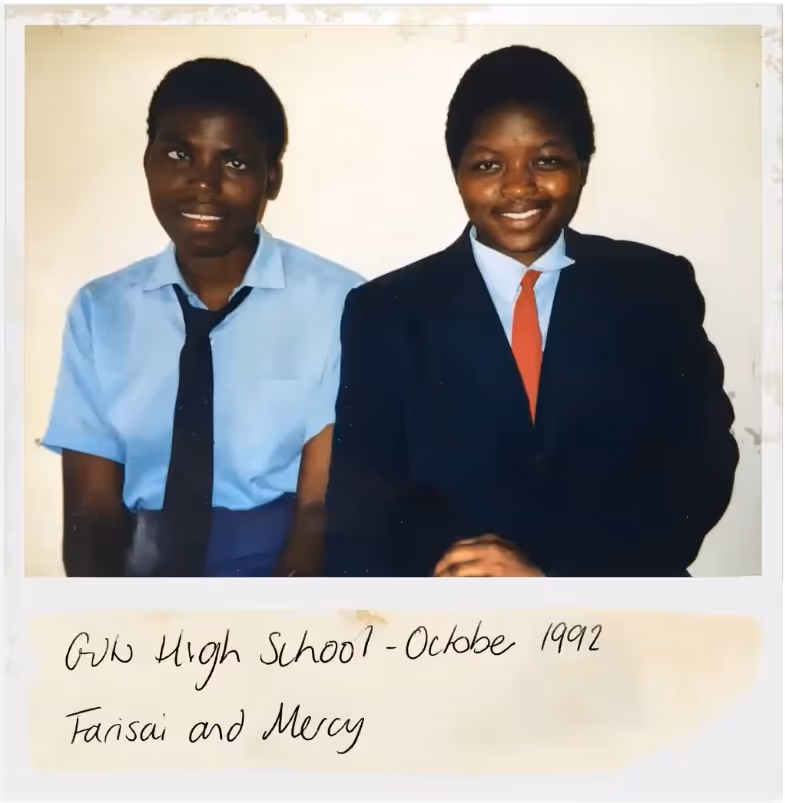 A school picture of Farisai and Mercym from 1992. Both kids are wearing ties.
