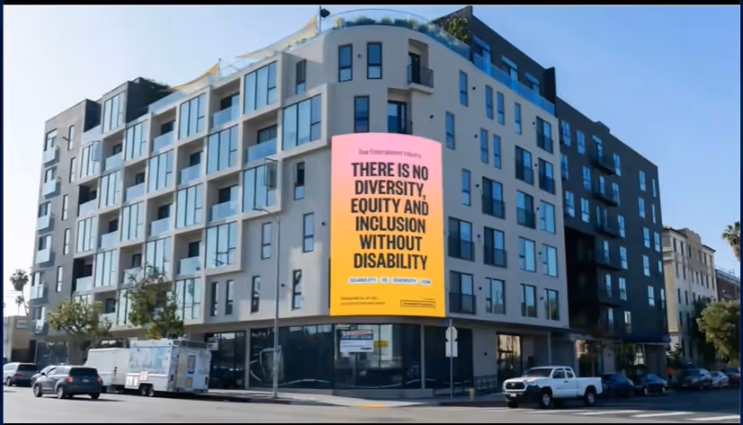 Image of a building with a sign "There is no diversity, equty and inclusion without disability" 