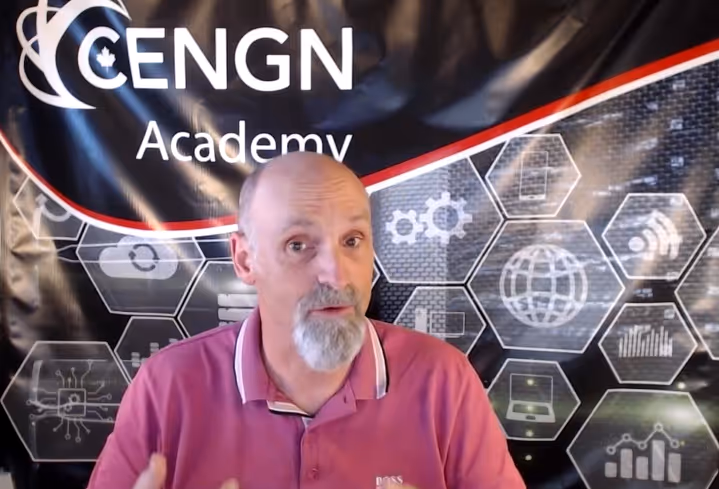 Peter Heath standing in front of the CENGN Academy banner