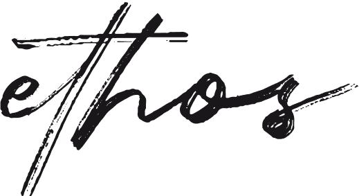 Stylized handwritten text spelling 'ethos' in black ink with artistic brush strokes.