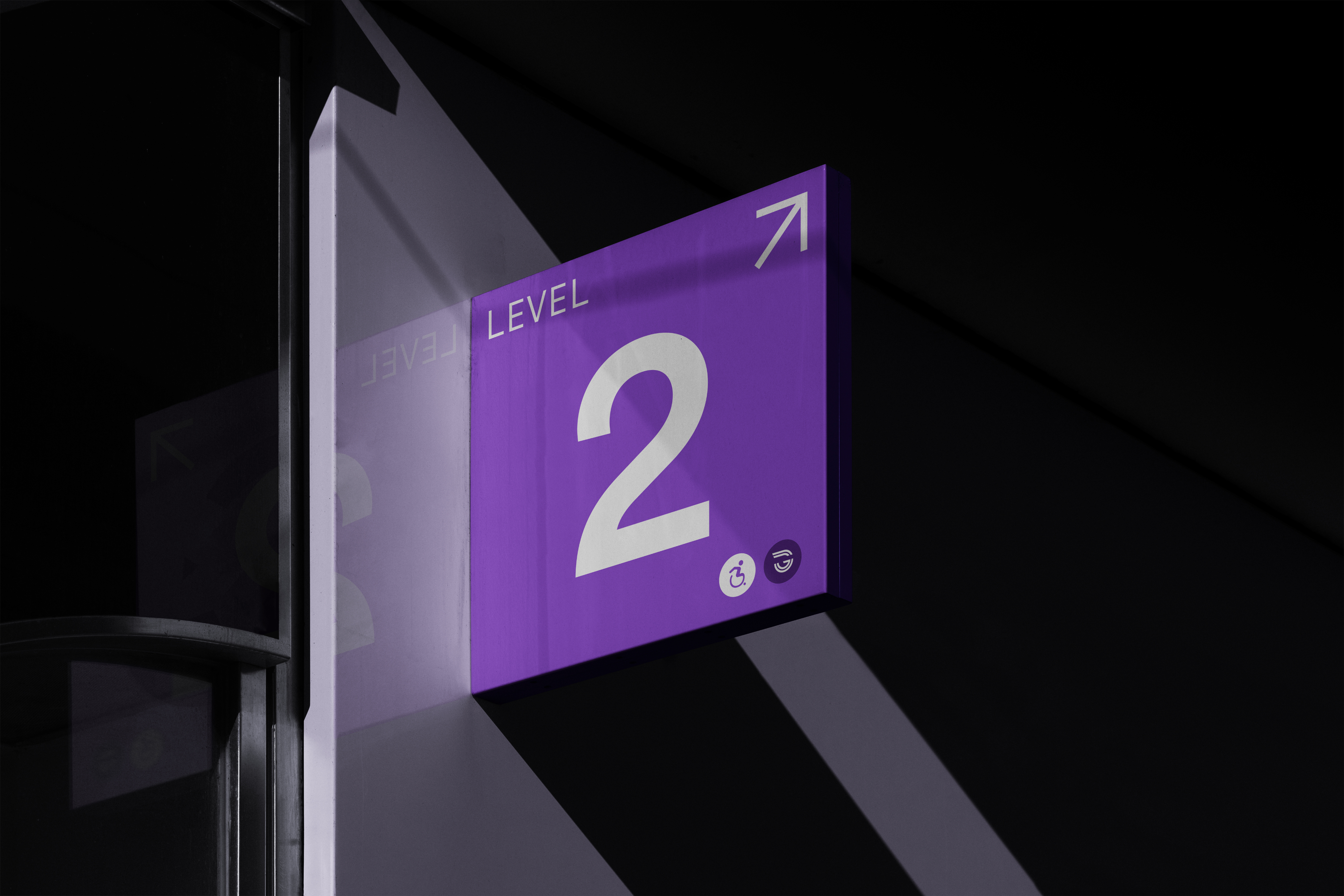 Level marker sign mounted overhead in a station