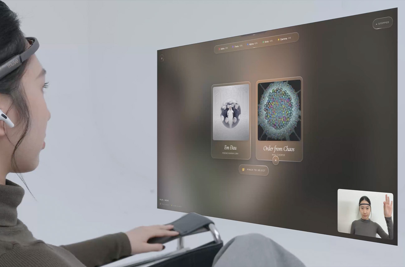 A woman using her hand to control the art installation ui 