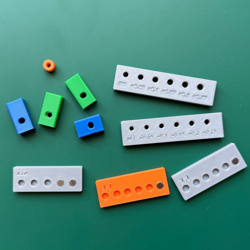 Testing 3D print tolerances and part dimensions for magnets and screws.