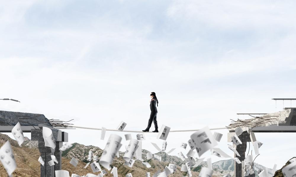 A person walking on a tightropeAI-generated content may be incorrect.