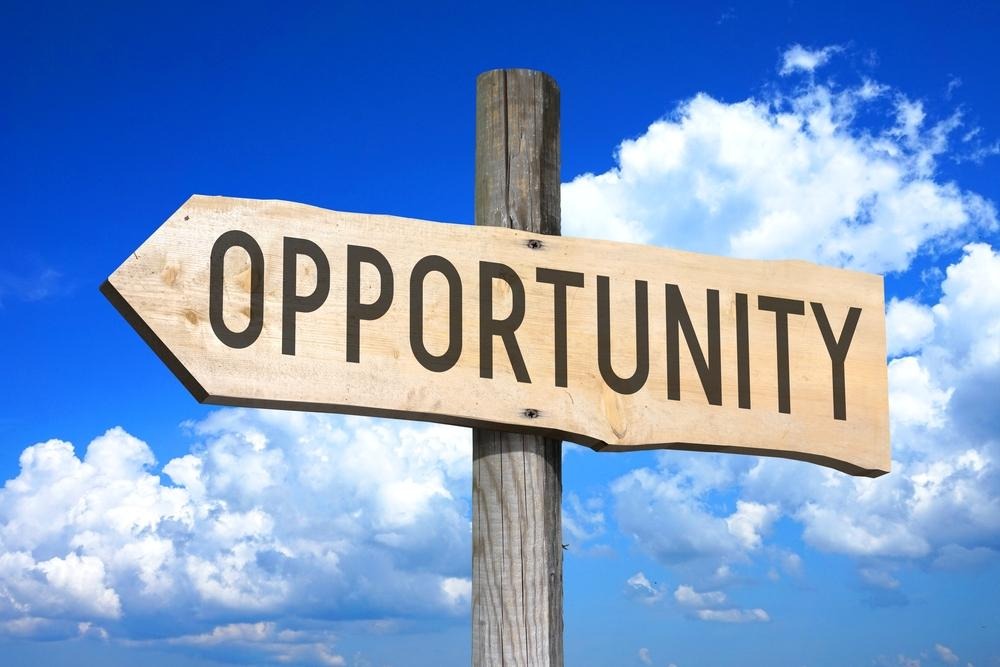 A wooden sign with a signpostAI-generated content may be incorrect.