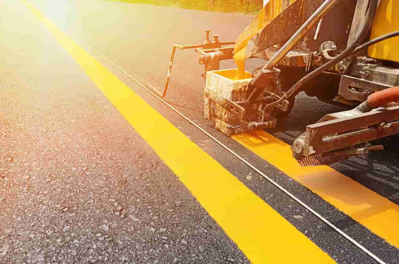 Vehicle performing line painting on a road